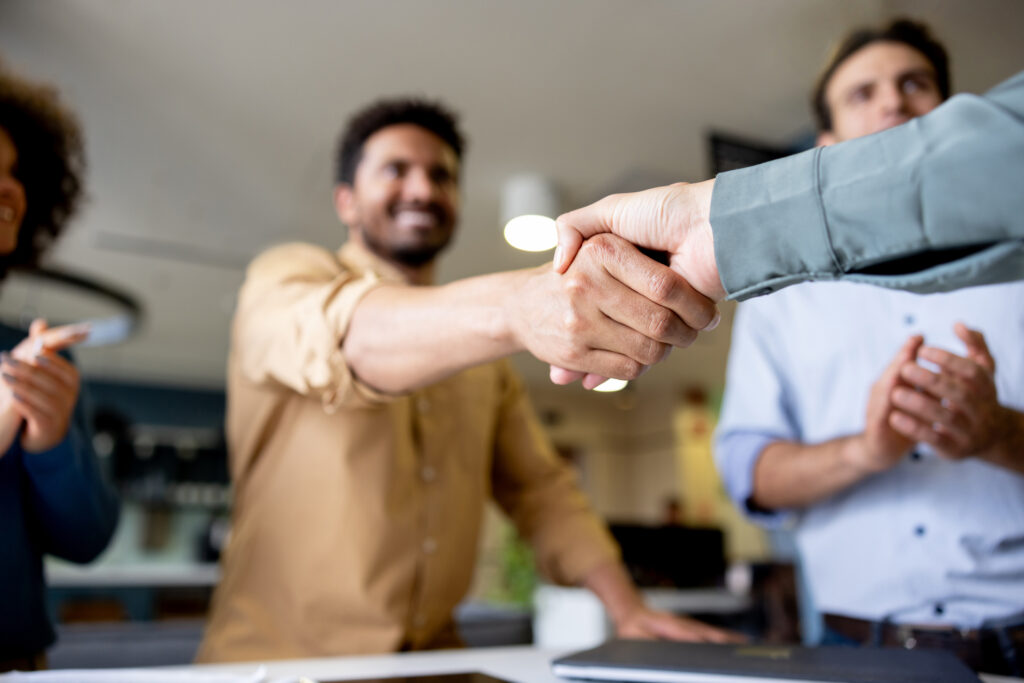 Close-up on a business handshake at the office